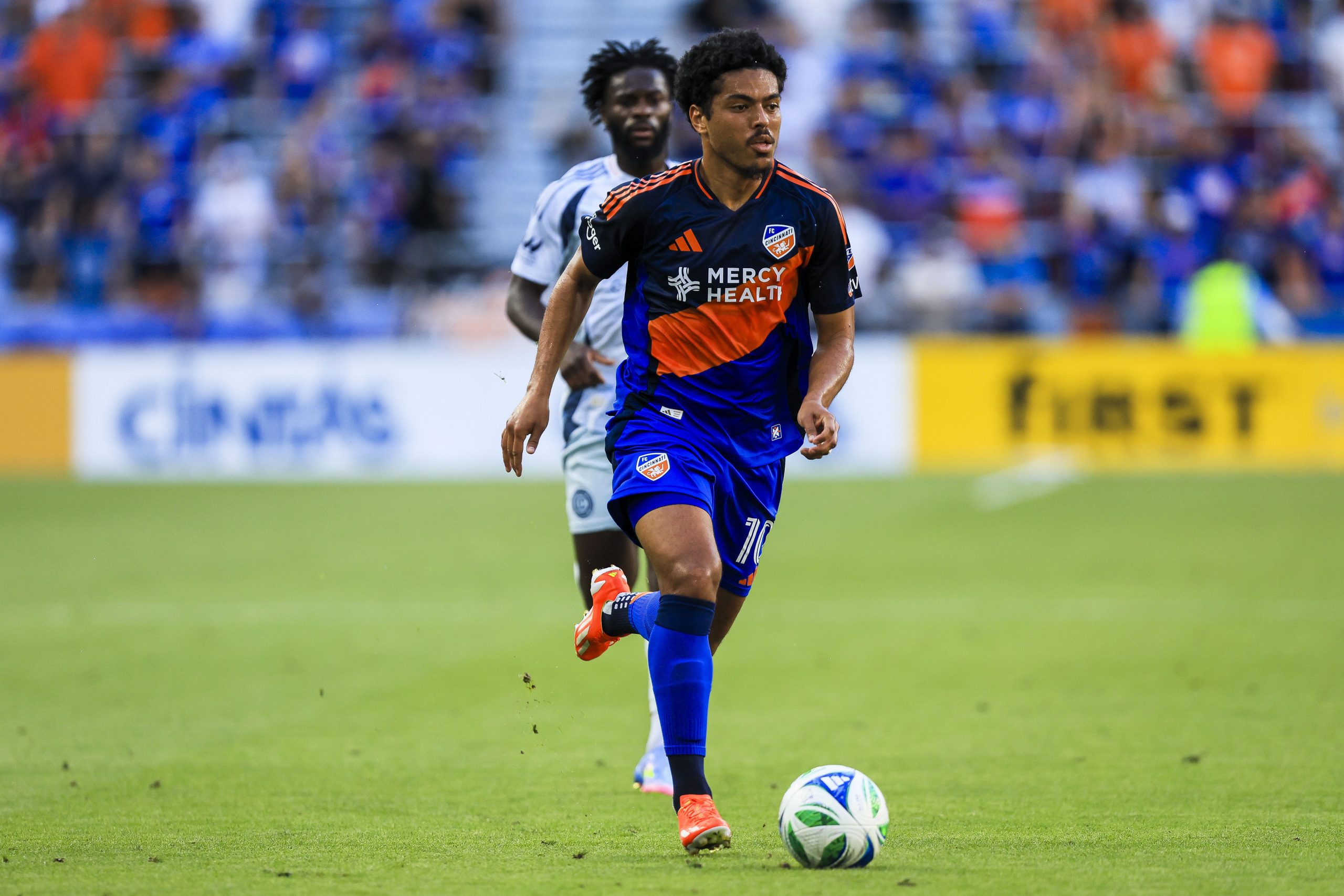 Jul 5, 2025; Cincinnati, Ohio, USA; FC Cincinnati midfielder Evander (10) dribbles against Chicago Fire FC in the first half at TQL Stadium. Mandatory Credit: Katie Stratman-Imagn Images