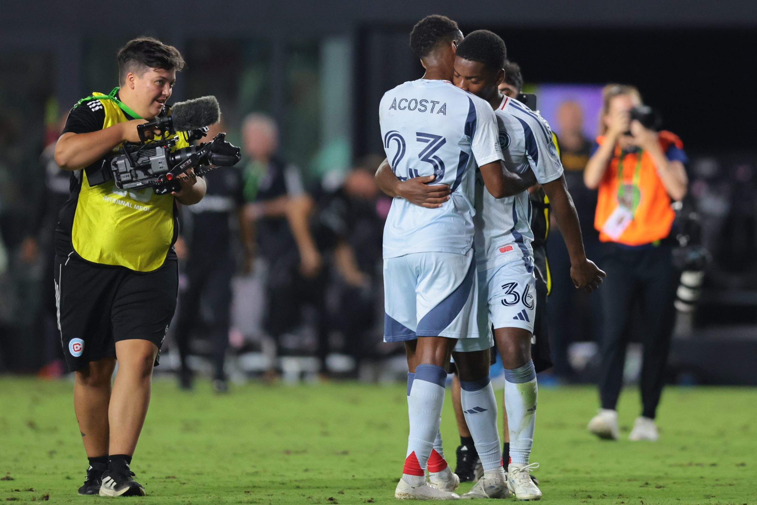 Sep 30, 2025; Fort Lauderdale, Florida, USA; Chicago Fire midfielder Kellyn Acosta (23) and defender Justin Reynolds (36) celebrate after the game against Inter Miami CF at Chase Stadium. Mandatory Credit: Sam Navarro-Imagn Images