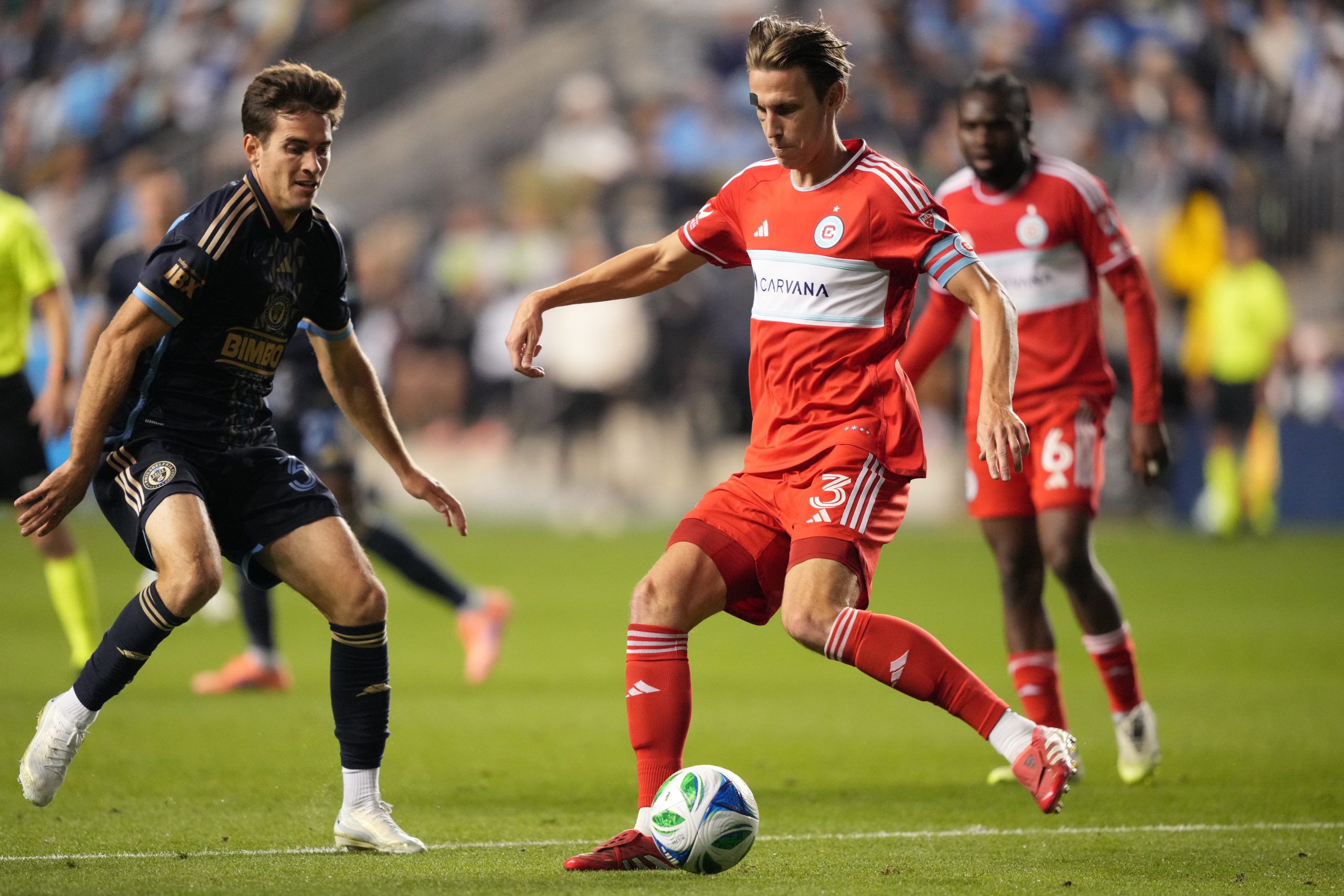 Oct 26, 2025; Chester, Pennsylvania, USA; Chicago Fire FC defender Jack Elliott (3) passes the ball against Philadelphia Union forward Milan Iloski (32) in the second half at Subaru Park. Mandatory Credit: Kyle Ross-Imagn Images