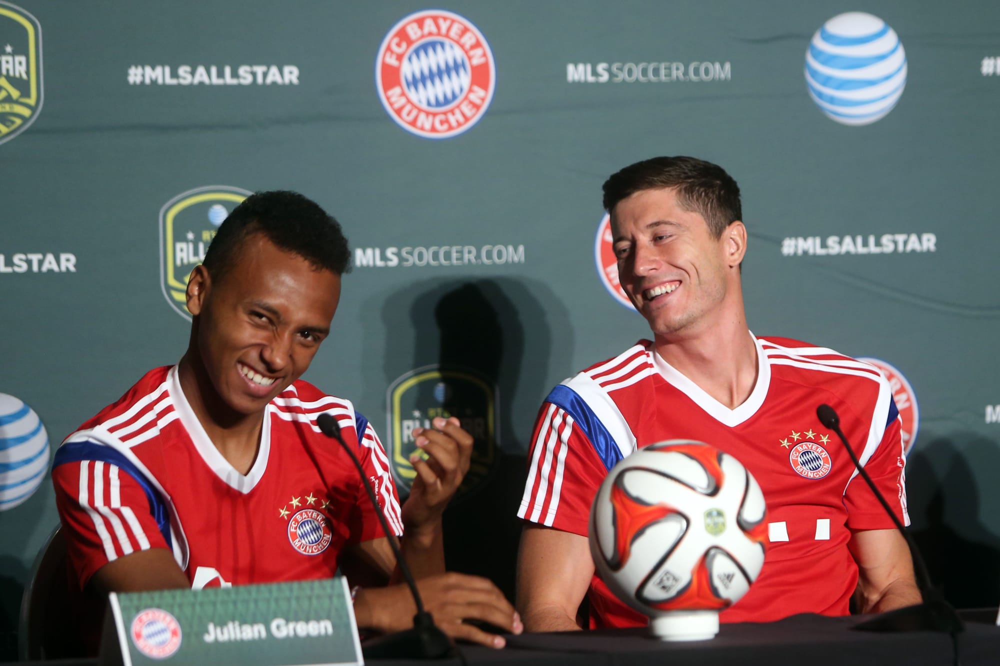 Aug 4, 2014; Portland, OR, USA; Bayern Munich players Julian Green (left) and Robert Lewandowski (right) react during a press conference in advance of the 2014 MLS All Star Game at The Nines Hotel.