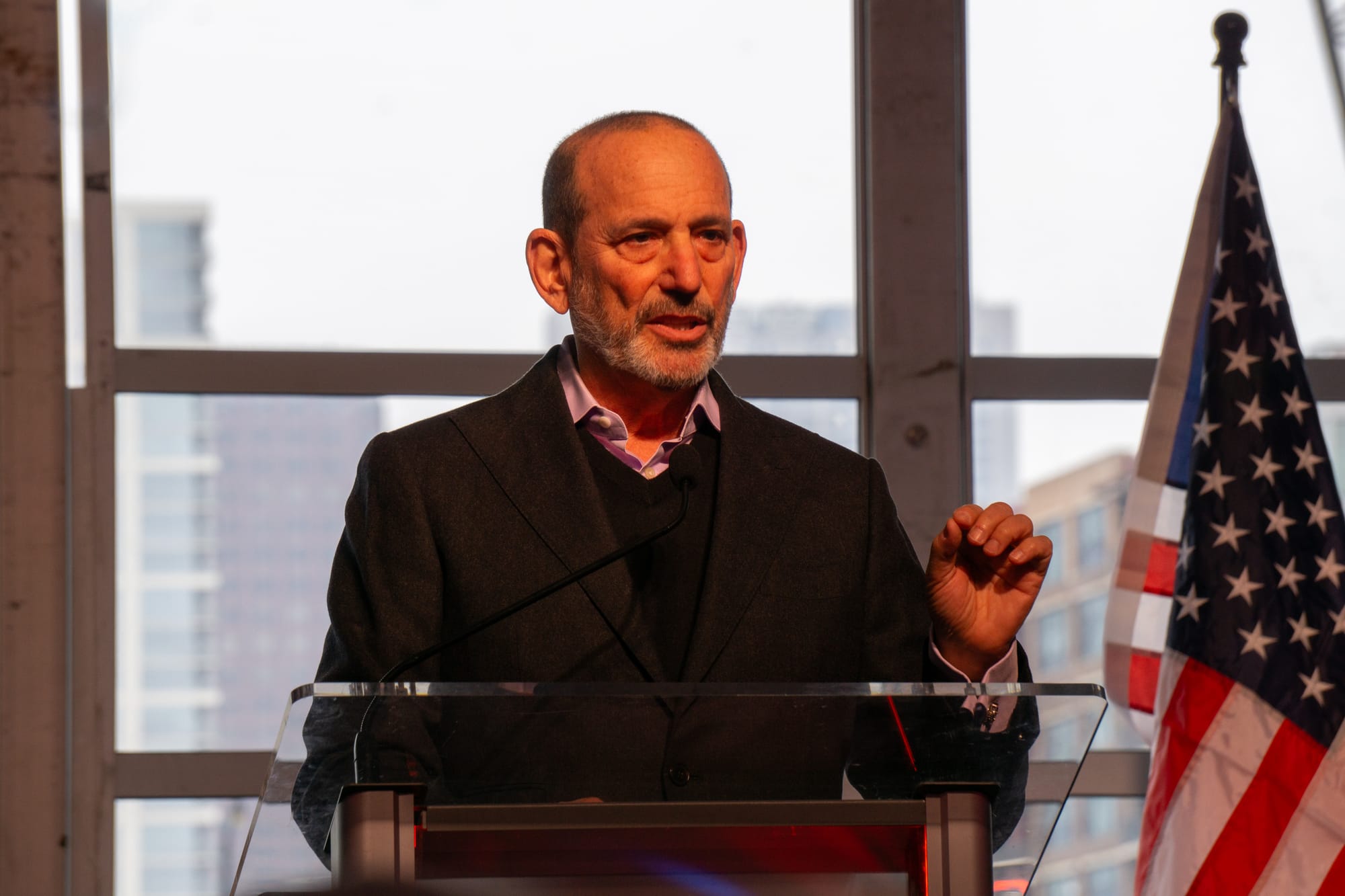 MLS Commissioner Don Garber standing at a podium