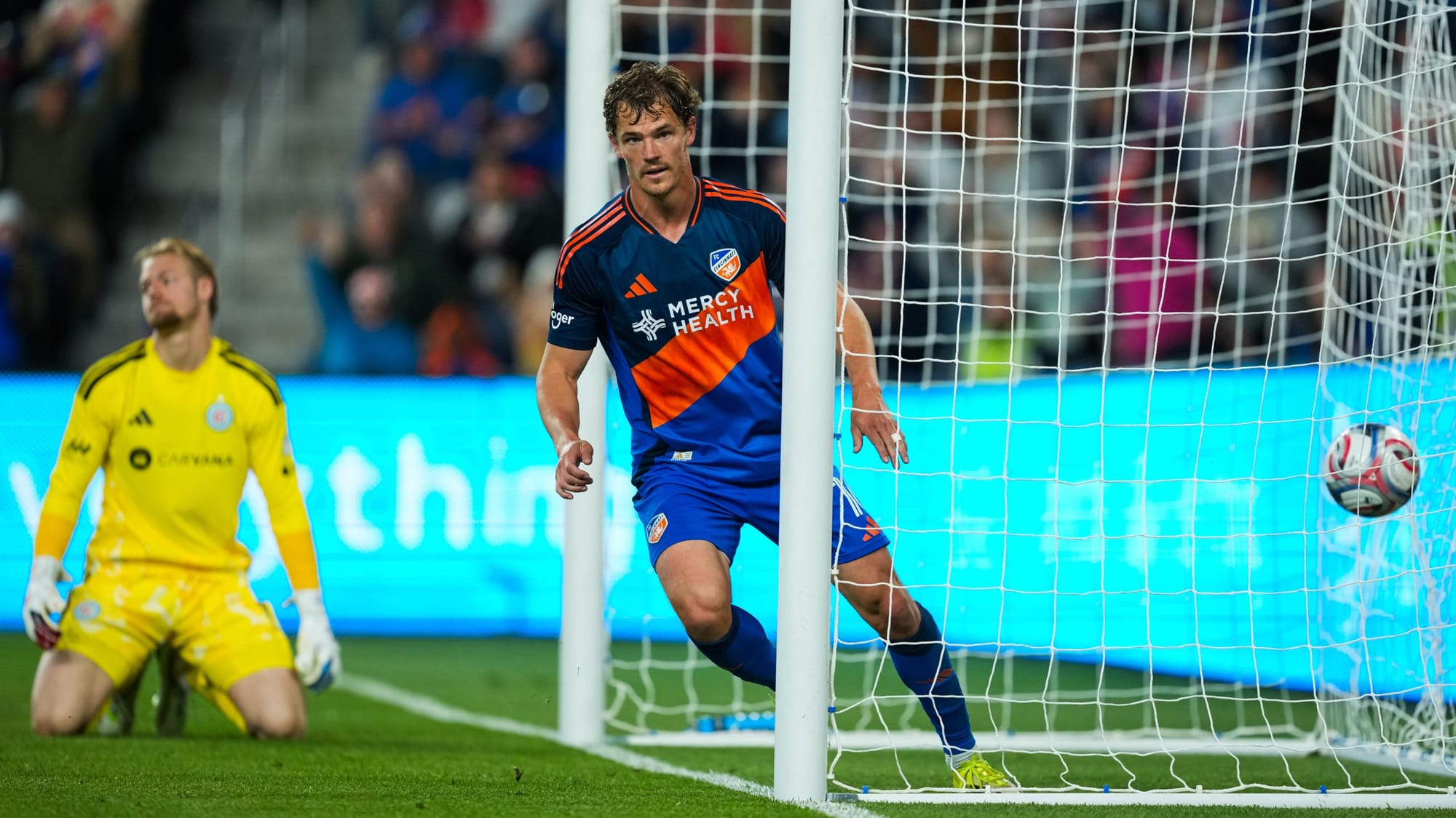 Tom Barlow scores against Chicago Fire with Chris Brady in the background