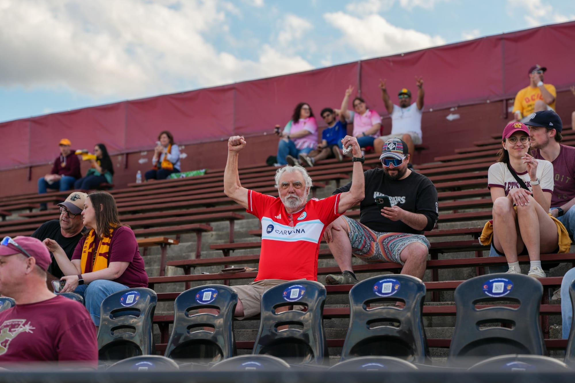 A fan in a Chicago Fire jersey in the stands