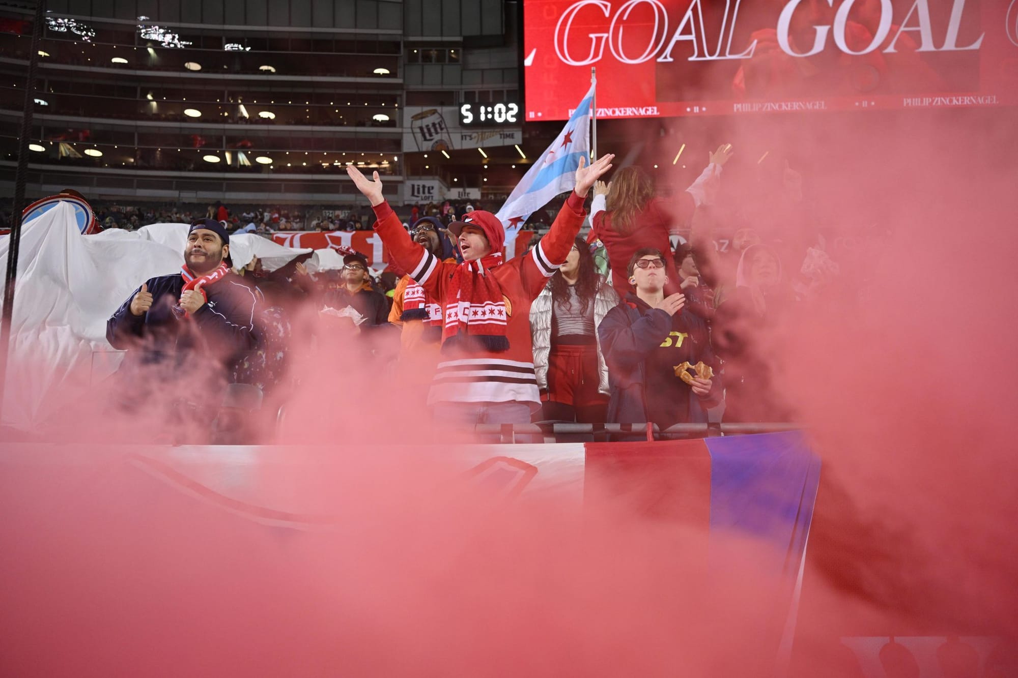 Fans celebrating at Soldier Field after the Fire's opening goal against Sporting Kansas City 