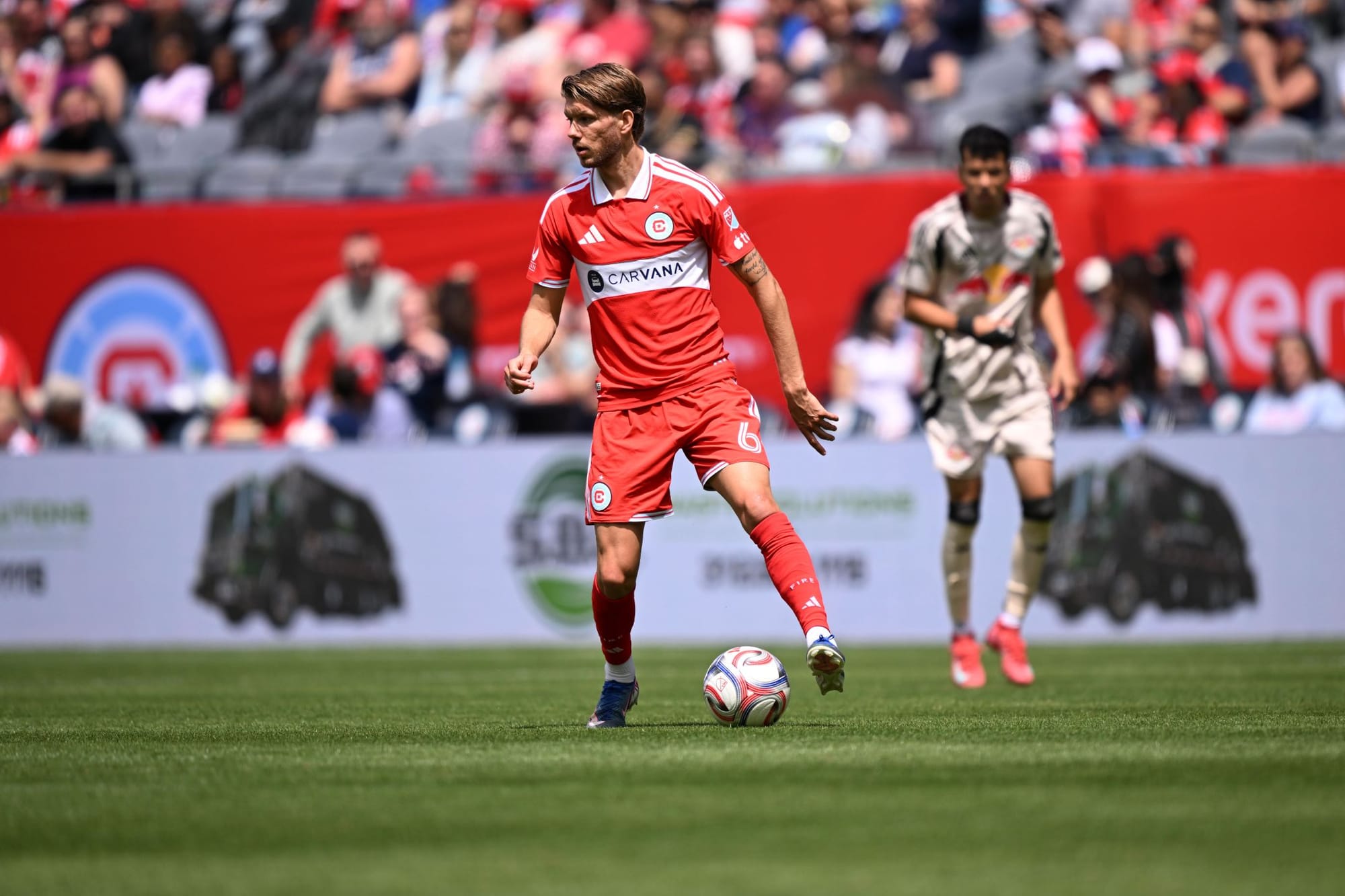 Anton Salétros of the Chicago Fire play the ball vs RBNY at Soldier Field on May 9, 2026