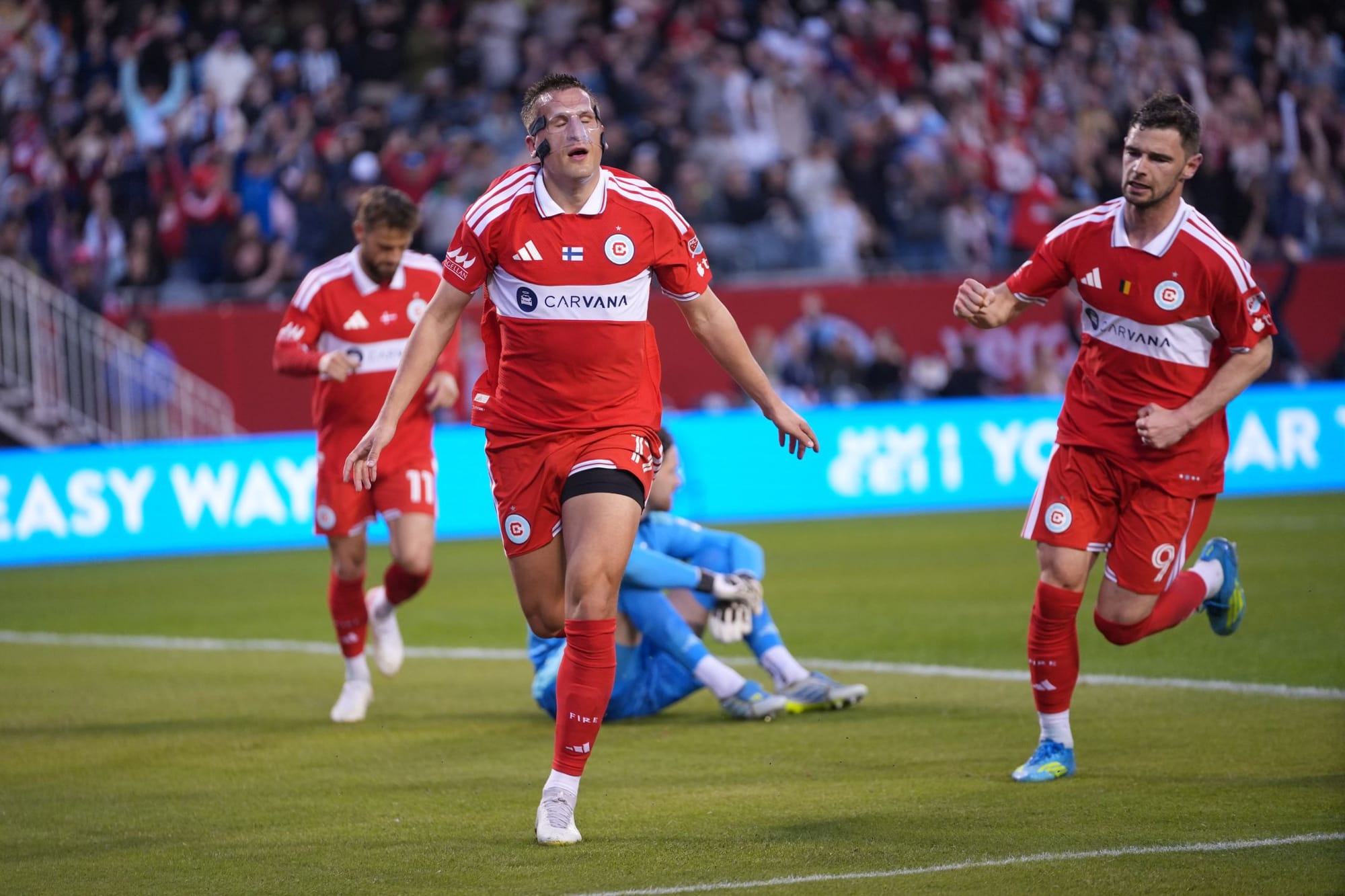 Robin Lod celebrating after scoring