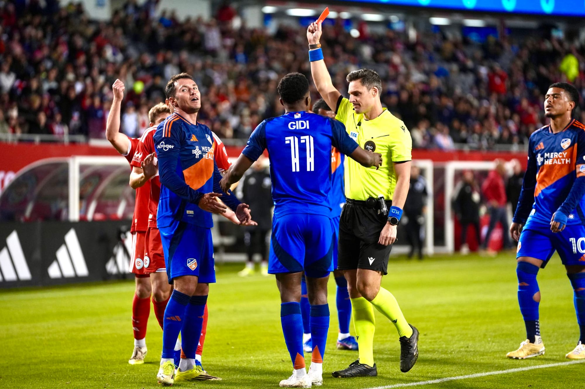 FC Cincinnati's Kyle Smith is shown a red card playing against the Chicago Fire at Soldier Field. 