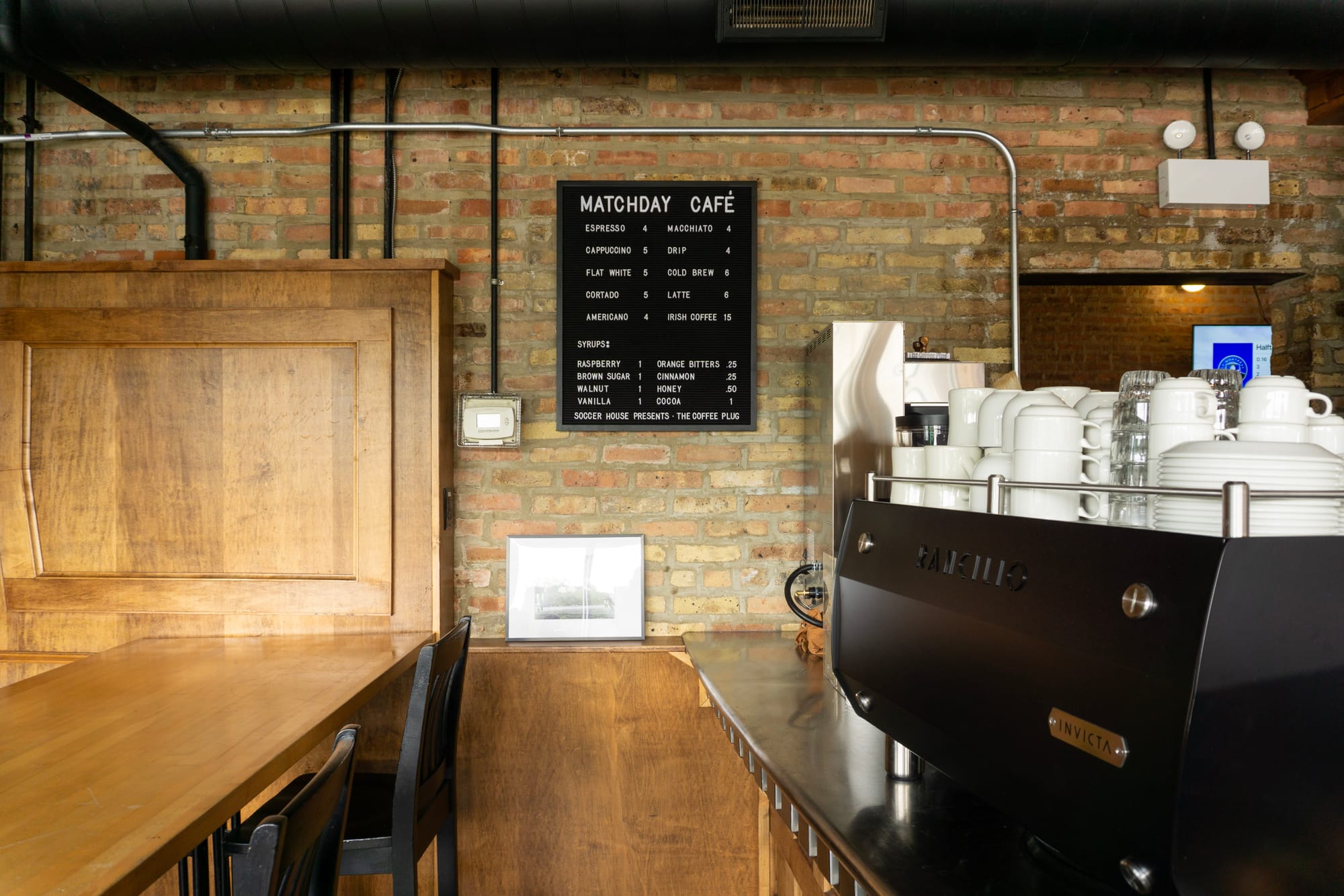 Shot of "Matchday Café" menu at Soccer House and the espresso machine
