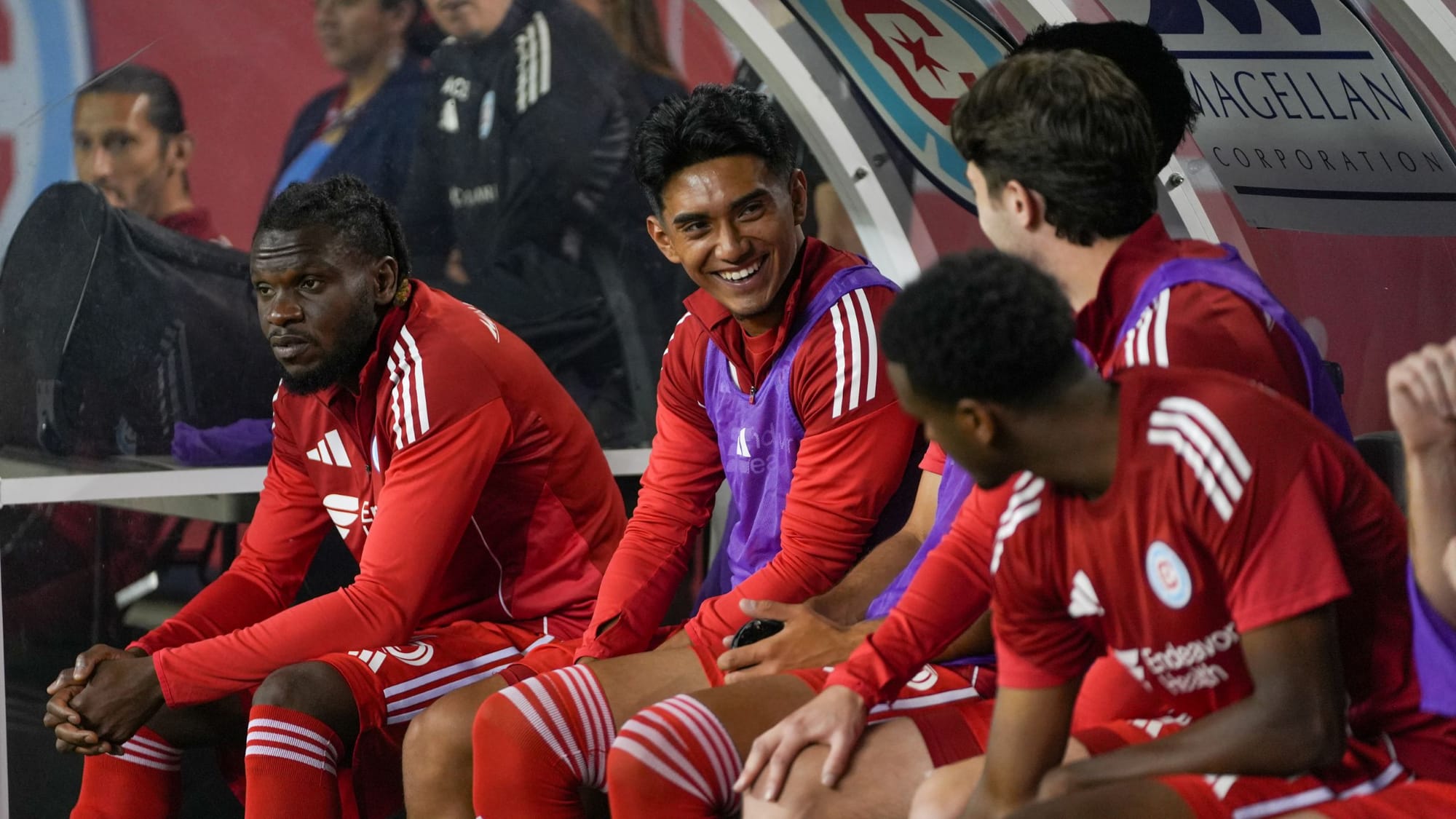 Sergio Oregel Jr, Brian Gutiérrez and teammates on the bench at a Chicago Fire FC game against Columbus at Soldier Field in 2025