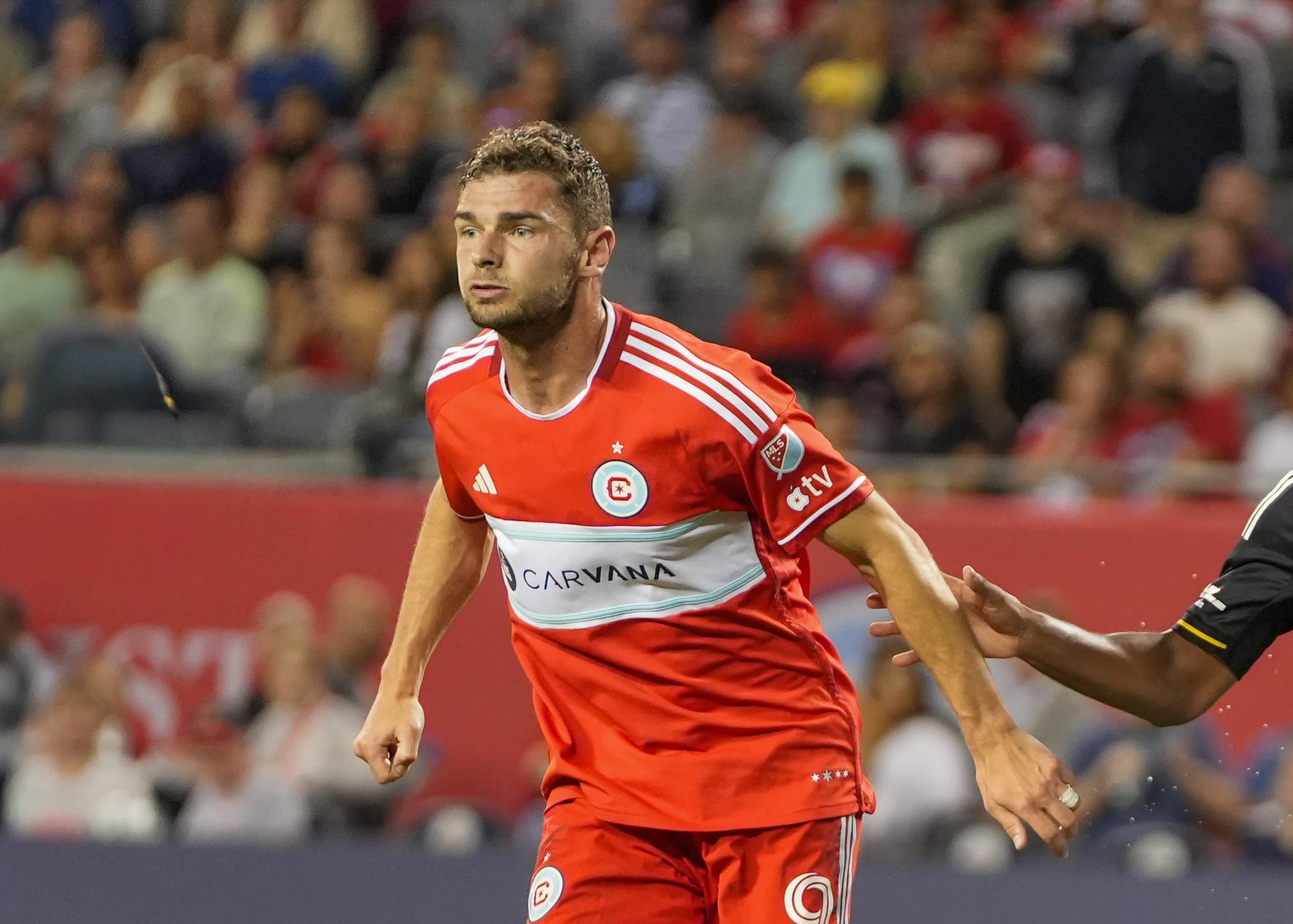 Chicago Fire striker Hugo Cuypers playing against Columbus Crew at Soldier Field in 2025.