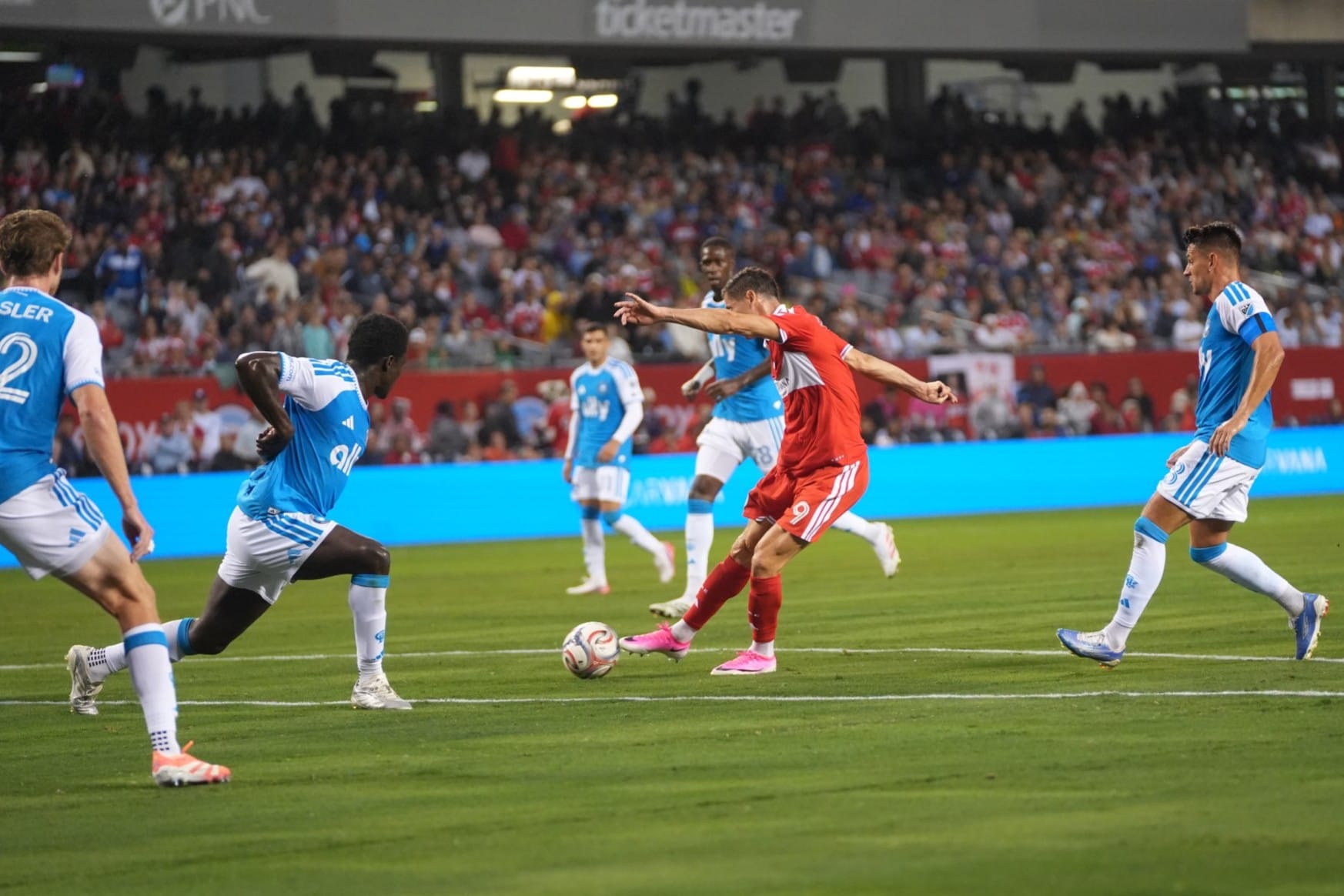 Robert Lewandowski strikes the ball to score a goal for the Chicago Fire at Soldier Field