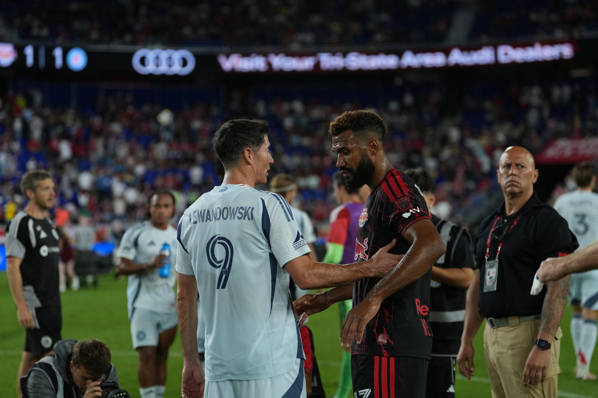 Robert Lewandowski of the Chicago Fire talks to the Red BUlls' Eric Maxim Choupo-Moting after the Fire's 1-1 draw at Sports Illustrated Stadium in Harrison, NJ