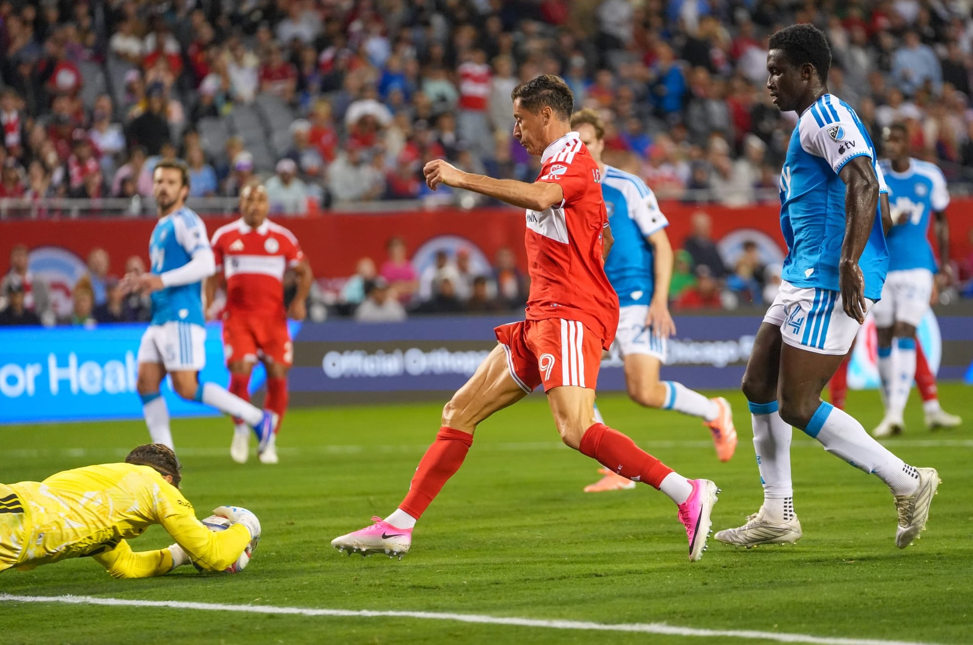 Robert Lewandowski can't quite get to a ball that's corralled by Charlotte's goalkeeper Kristijian Kahlina
