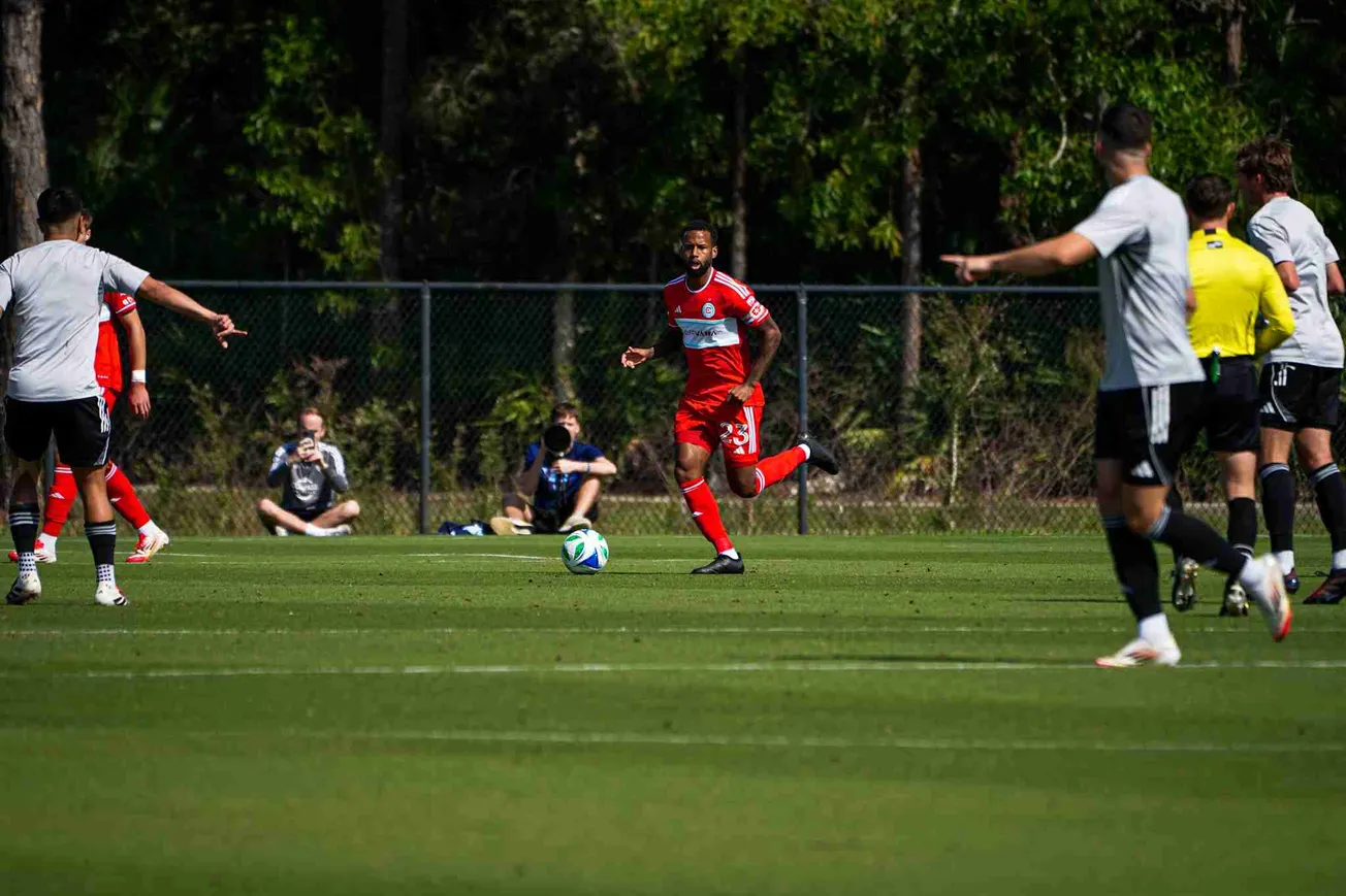 Kellyn Acosta playing in a preseason match against Sporting Kansas City in Florida