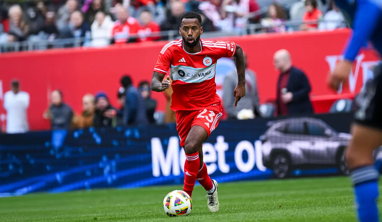 Kellyn Acosta plays the ball forward with the Chicago Fire in 2024 (Melissa Tamez-USA TODAY Sports)