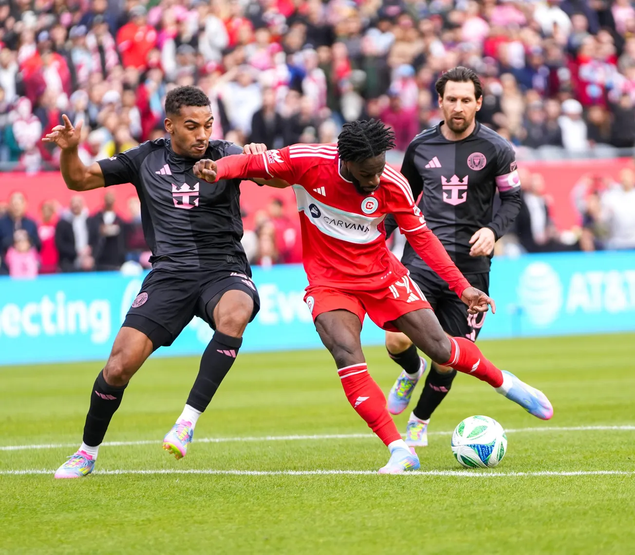 Jonathan Bamba plays the ball against Lionel Messi and Inter Miami at Soldier Field on April 13, 2025