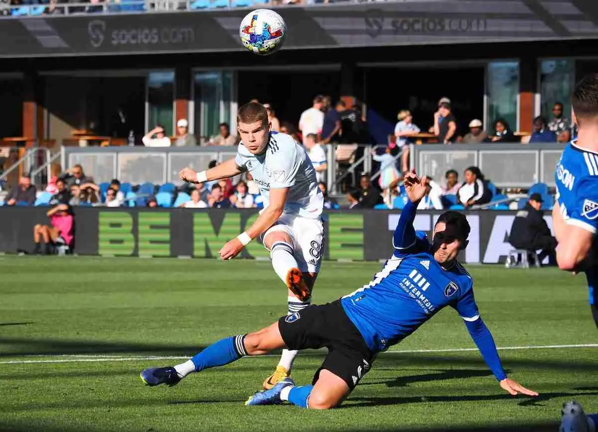 Jul 3, 2022; San Jose, California, USA; Chicago Fire midfielder Chris Mueller (8) shoots against San Jose Earthquakes defende