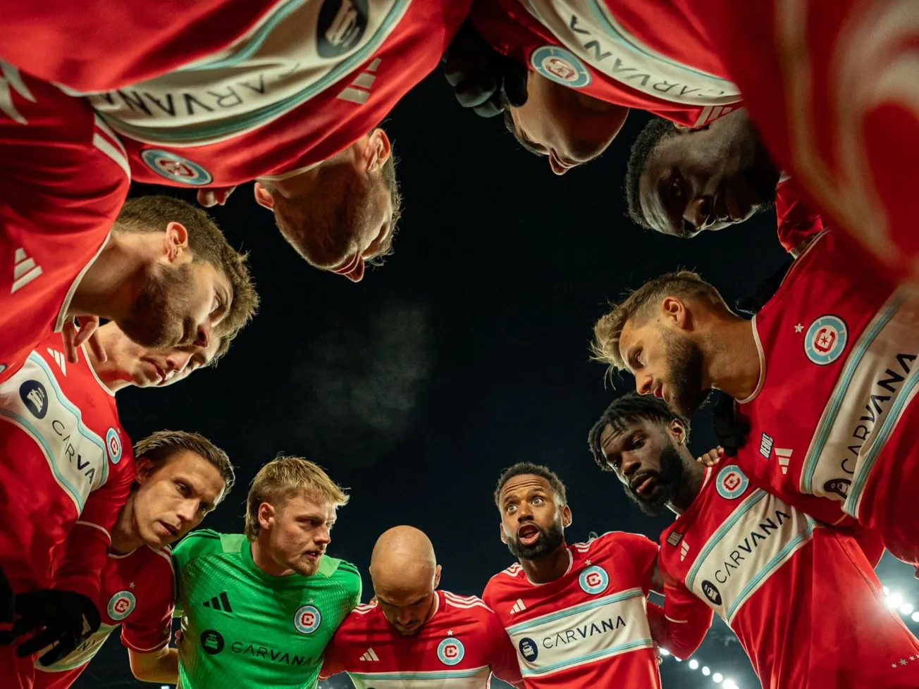 Chicago Fire players huddle before facing the Columbus Crew in their season opener on February 22, 2025 at Lower.com Field in