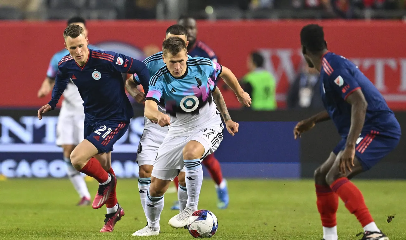 Apr 8, 2023; Chicago, Illinois, USA; Minnesota United midfielder Robin Lod (17) controls the ball in front of Chicago Fire FC