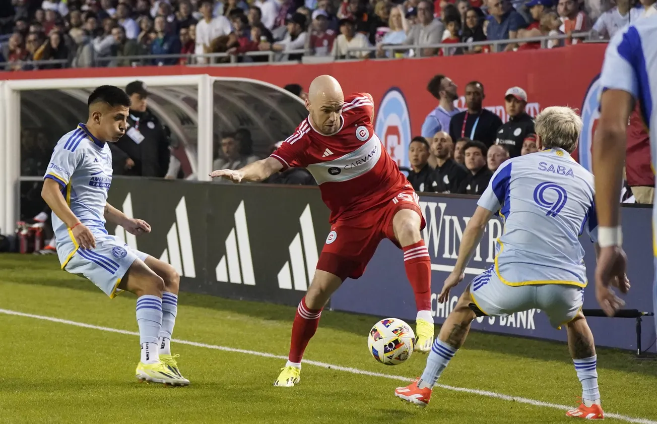 Apr 27, 2024; Chicago, Illinois, USA; Chicago Fire FC defender Andrew Gutman (15) battles for the ball against Atlanta United