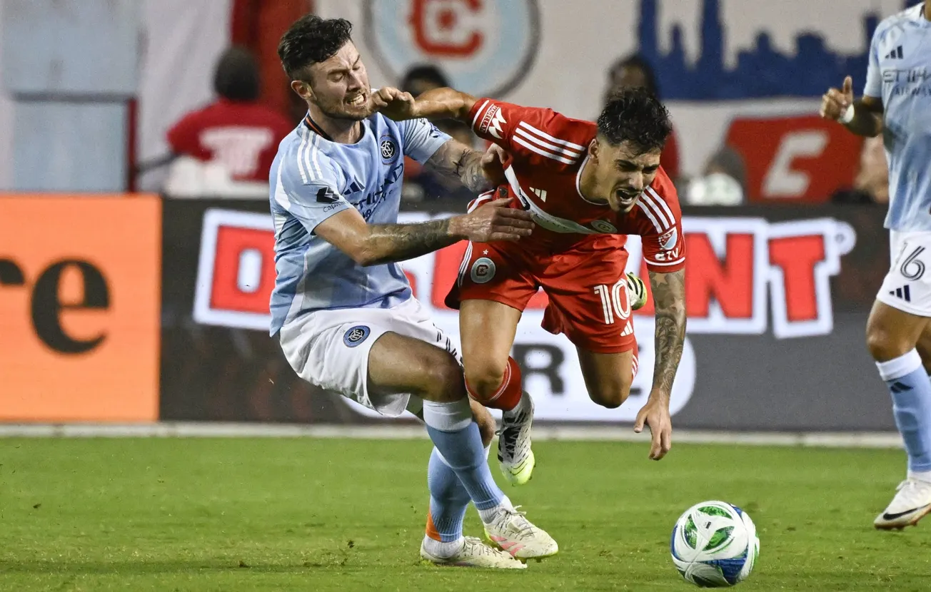 Sep 13, 2025; Chicago, Illinois, USA; New York City midfielder Aiden O'Neill (21) and Chicago Fire midfielder Andre Franco (1