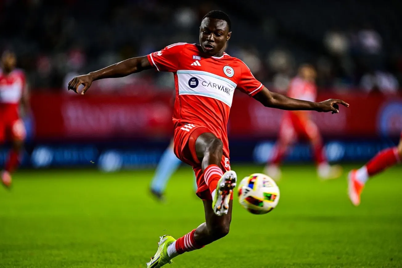 Omari Glasgow kicks the ball during a Chicago Fire FC game against the New England Revolution on May 4, 2024