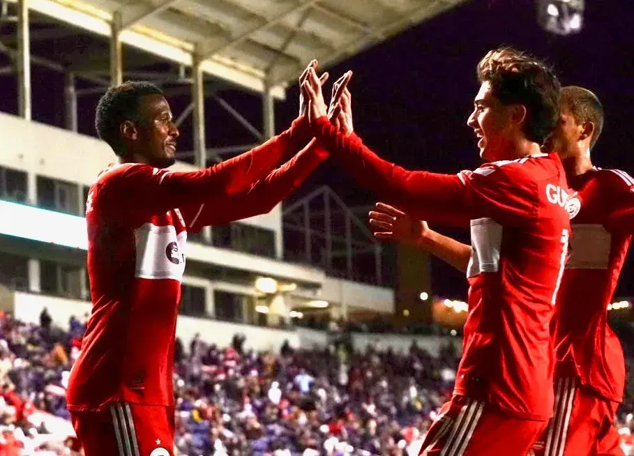 Djé D'Avilla and Brian Gutiérrez celebrate at SeatGeek Stadium in Chicago's 4-0 win over Detroit City on May 7, 2025
