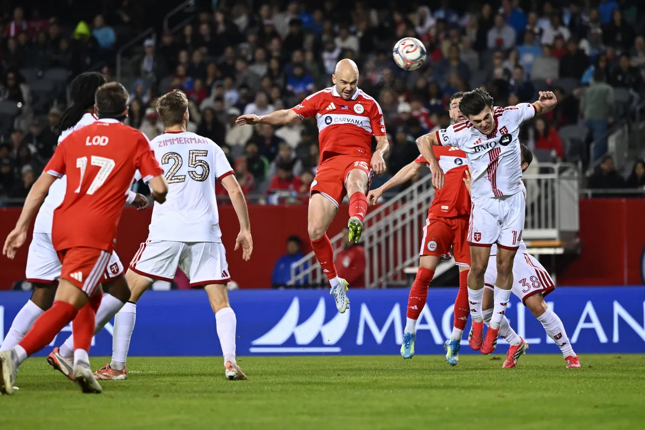 Andrew Gutman heads the ball for the game winner at Soldier Field against Toronto FC