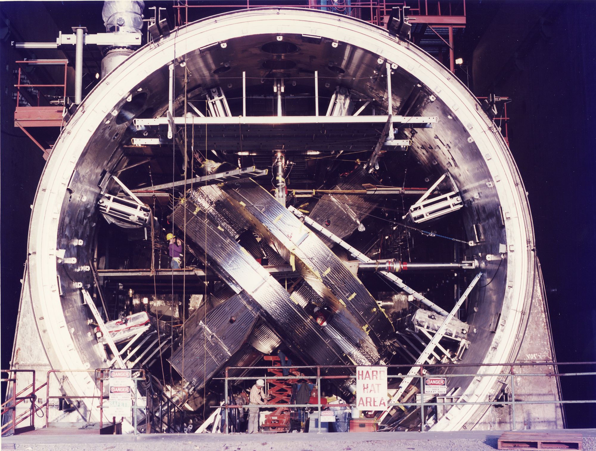 A photo of the massive building sized magnet in the MFTF-B under construction. 