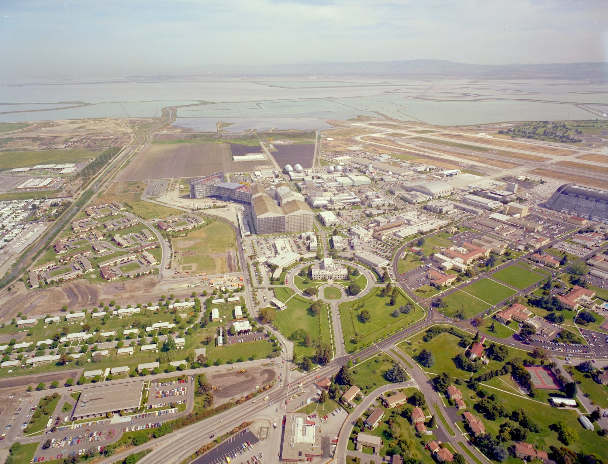 Aerial photo of NASA Ames Research Center looking out over the bay. 