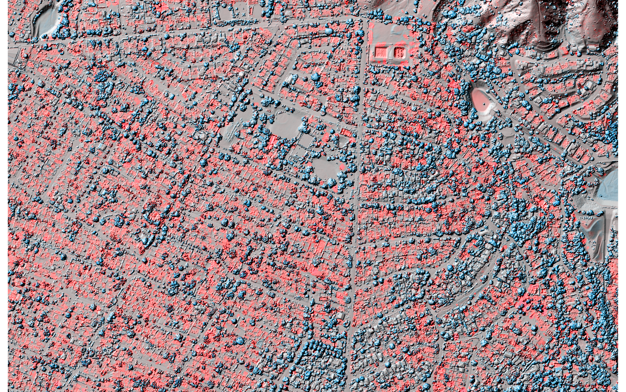A color visualization of the "diff" between the 2025 and 2016 post-fire LiDAR dataset (on top of the 2025 data). Red indicates a drop in elevation, blue indicates a rise. Structures and vegatation that have been destroyed are highlighted in red.