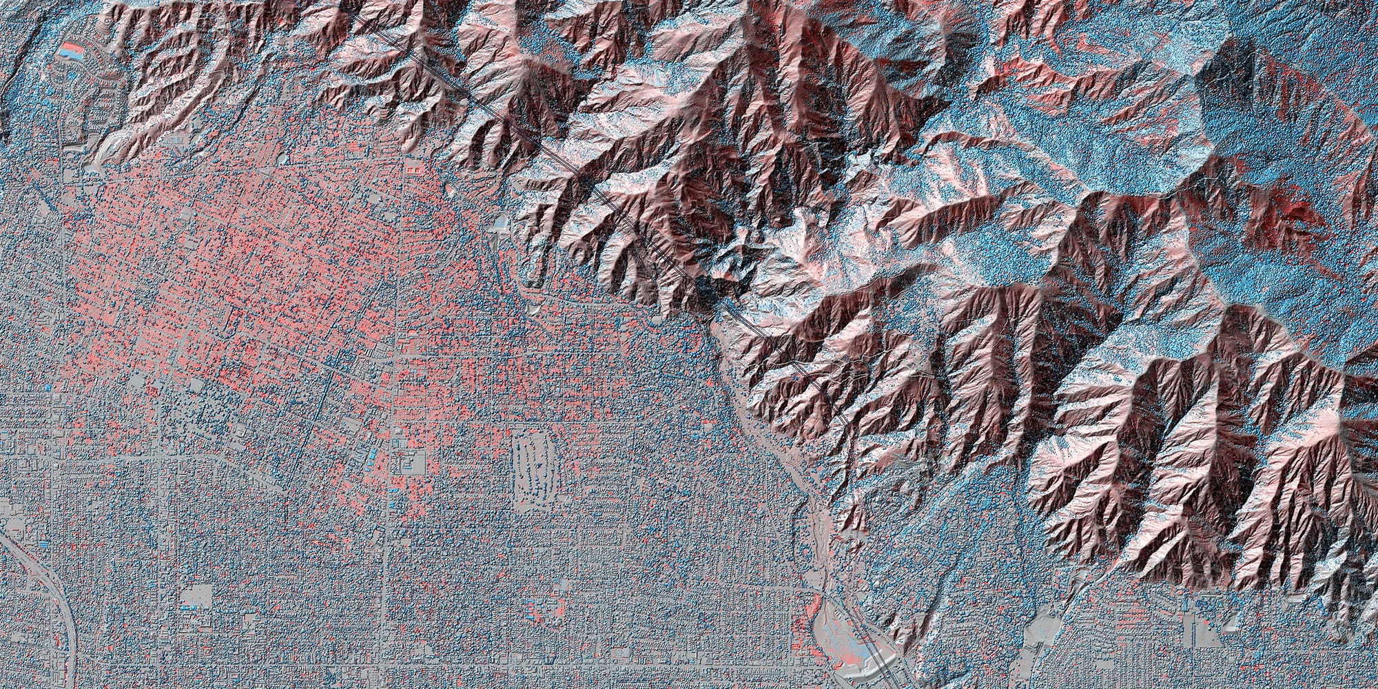 A visualization of the areas damaged by the Eaton fire in January 2025. LiDAR scans from 2016 and 2025 were compared to generate this visualization. Red indicates structures or vegetation not present in 2025. Blue indicates new vegetation or structures.