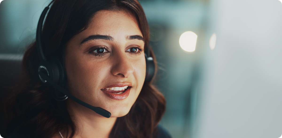 Close-up of a confident call center team lead with headset, symbolizing the impact of frontline leadership training on team performance.