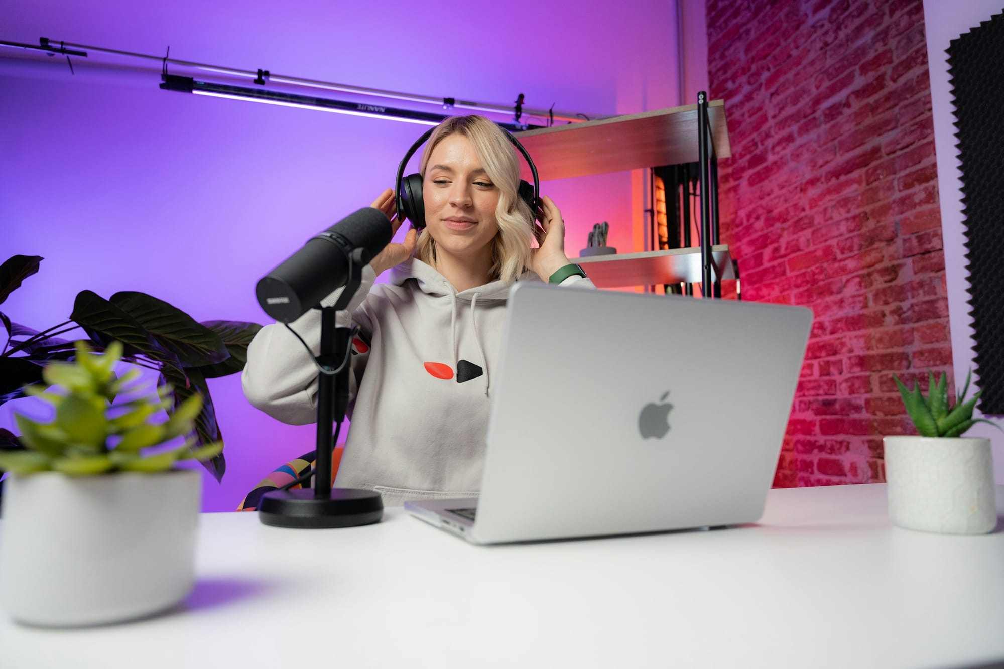 woman wearing headphones - Benefits of Social Media Video Marketing Strategy