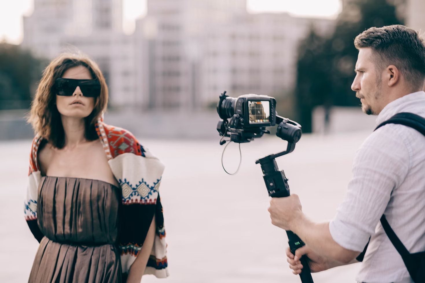 man recording a woman - How to Make a Reel on Instagram With Photos