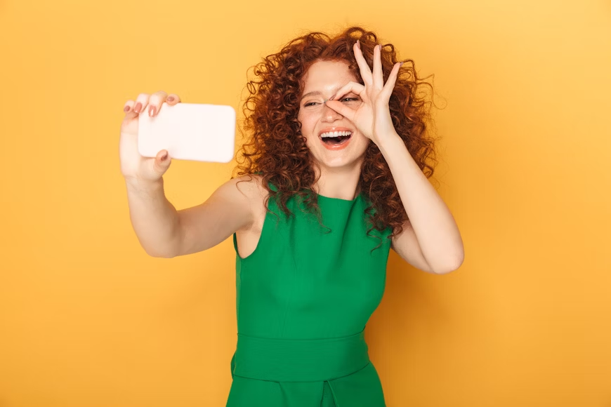 woman filming her phone - Instagram Story Length