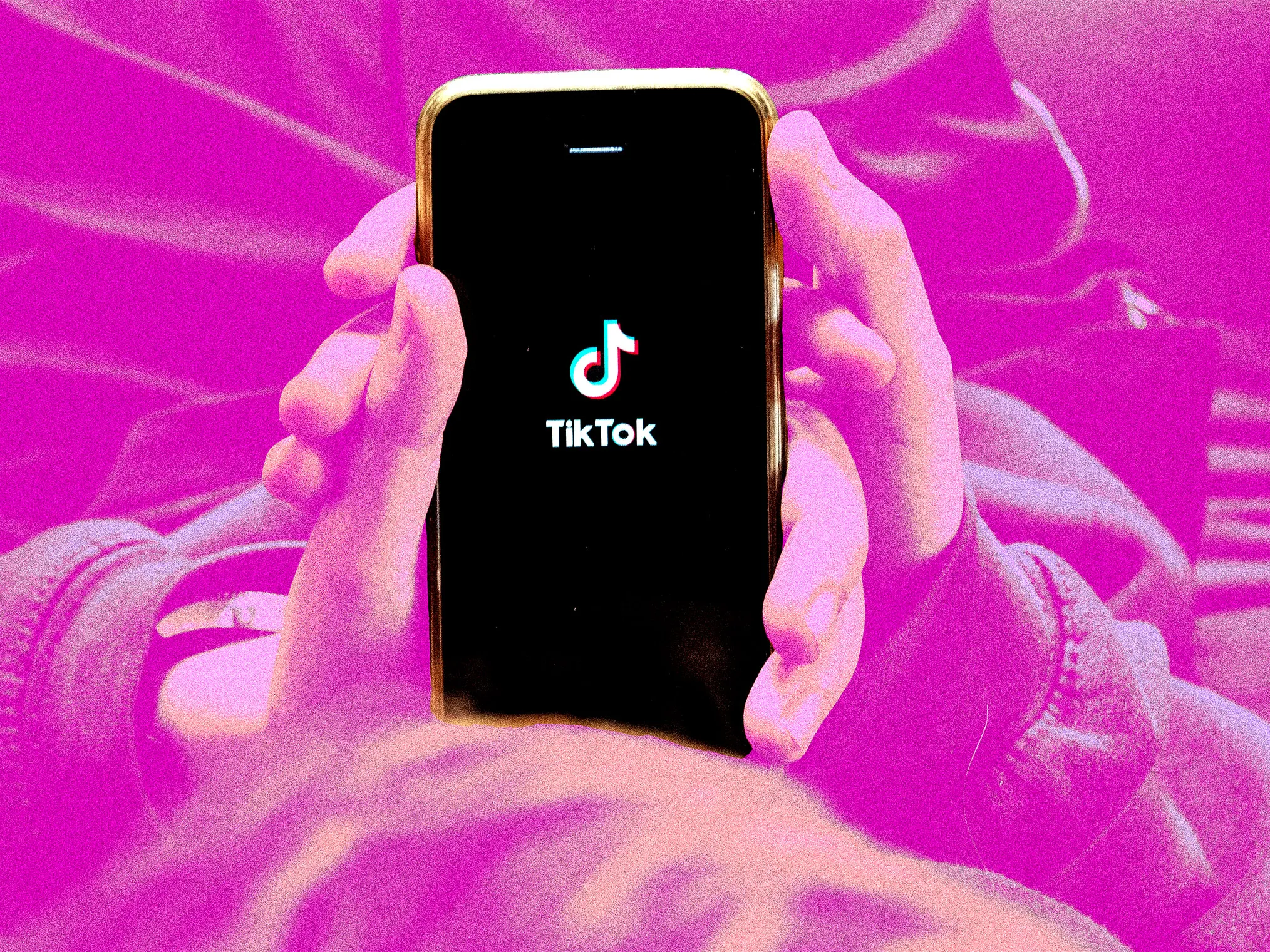 people holding tiktok - Why Can't I Download TikTok Videos