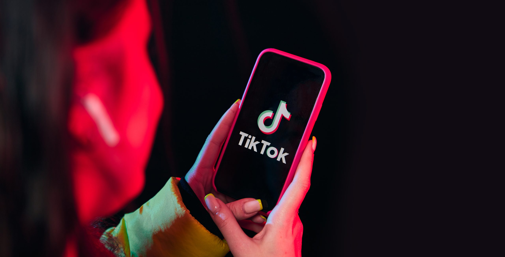woman using tiktok - How to Download All TikTok Videos at Once