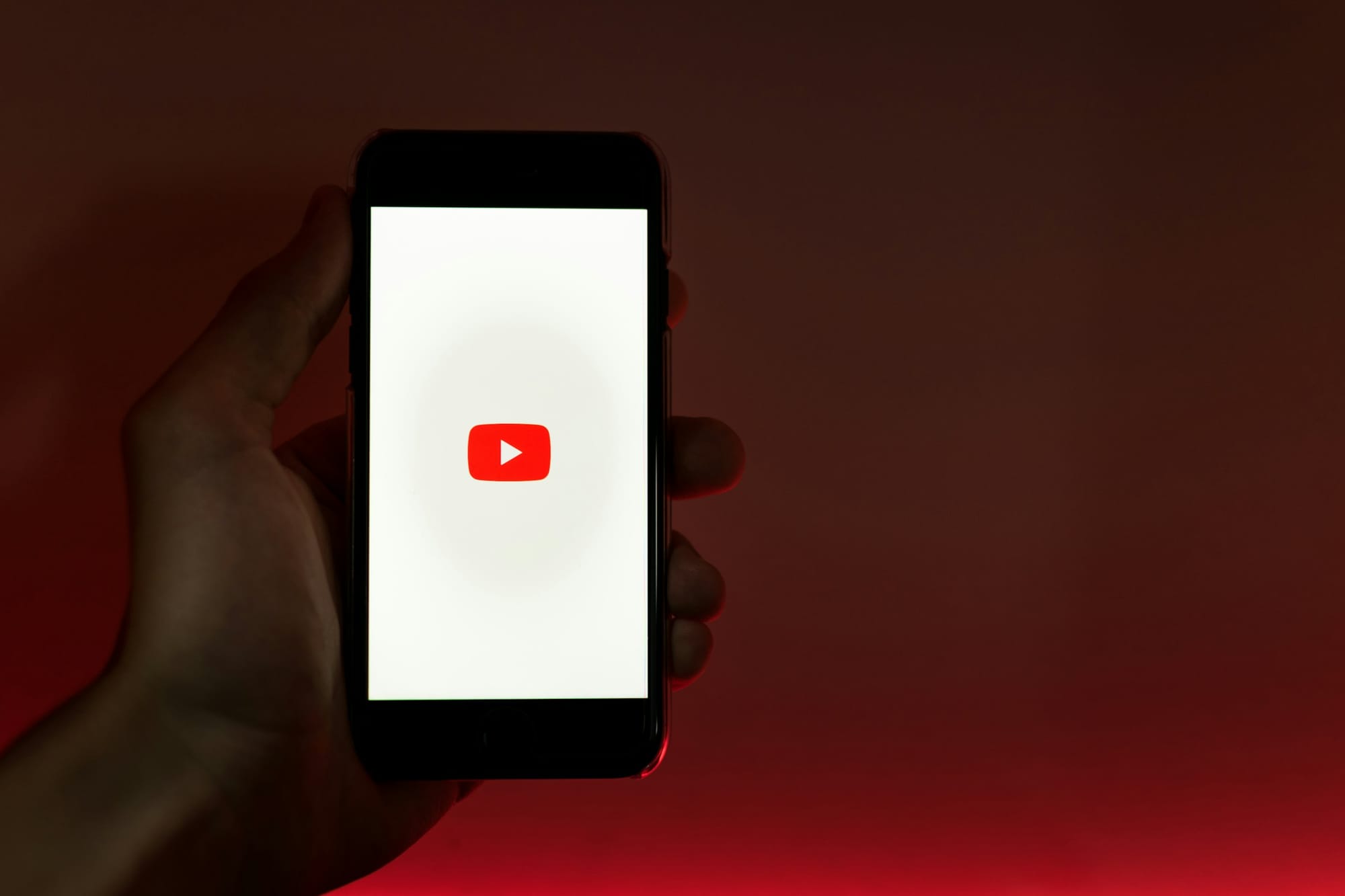 Person Holding Phone - How to download YouTube Shorts