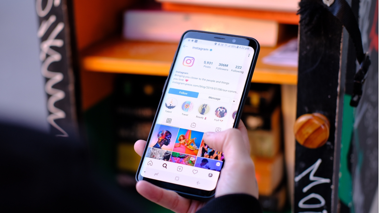 man using instagram on his phone - Best Time to Post Reels on Instagram