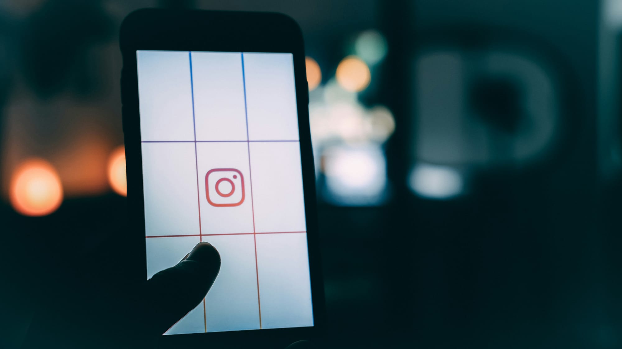 person holding smartphone - Are Reels Better Than Posts