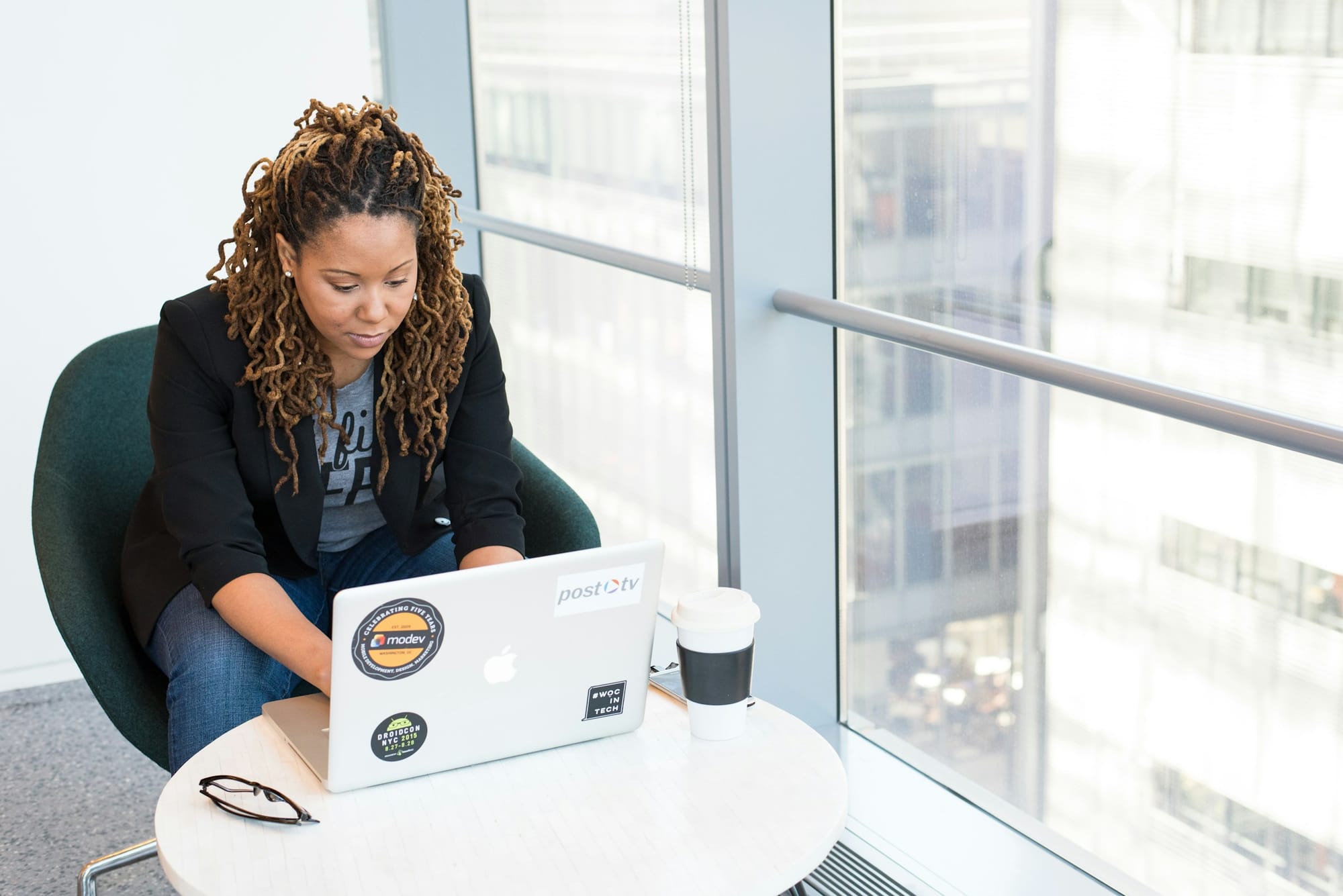 woman using a laptop - Content Pillars for Social Media