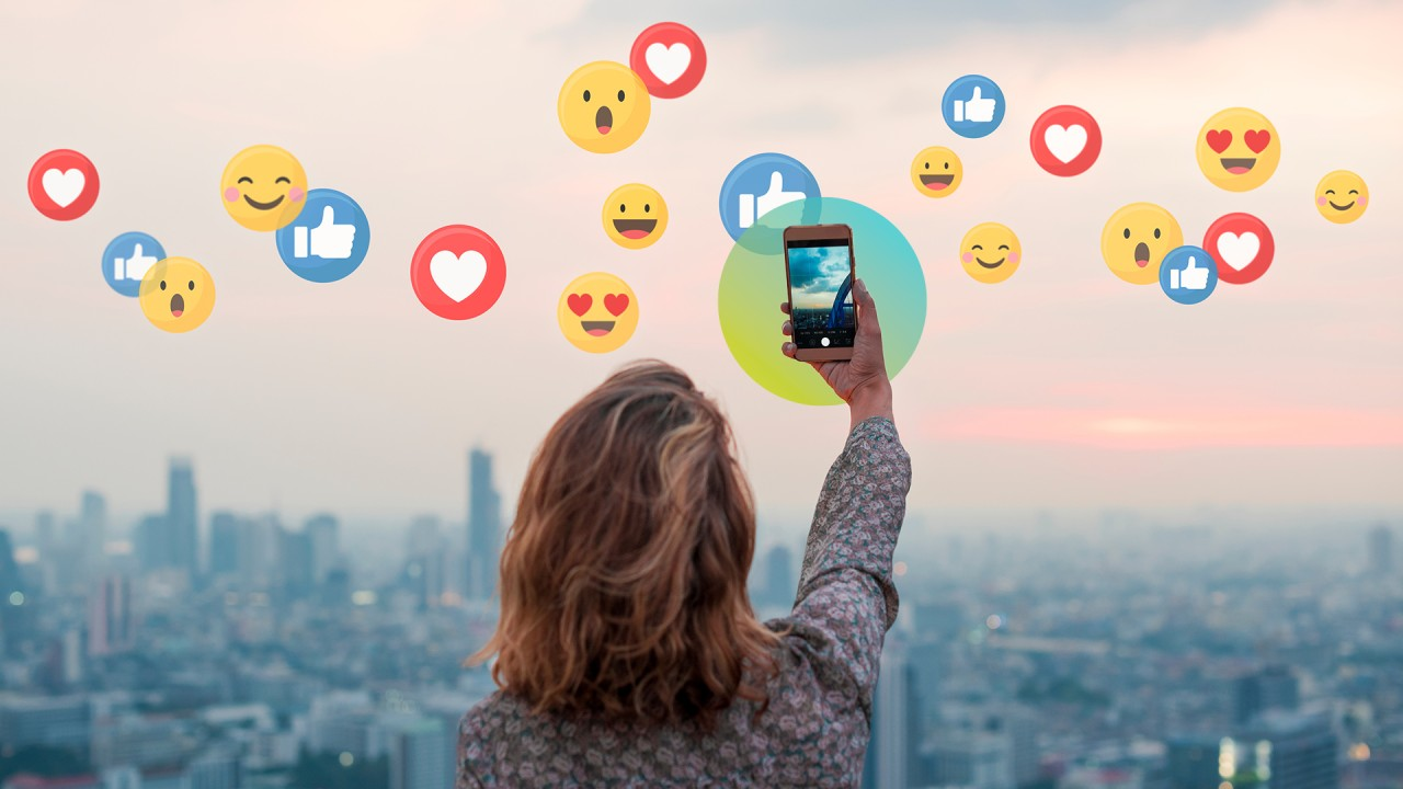 woman taking a photo - Social Media Content Guidelines