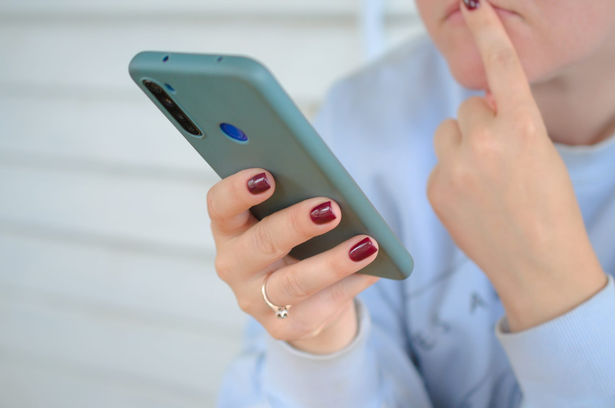 Person Thinking using Phone - Social Media Post Ideas