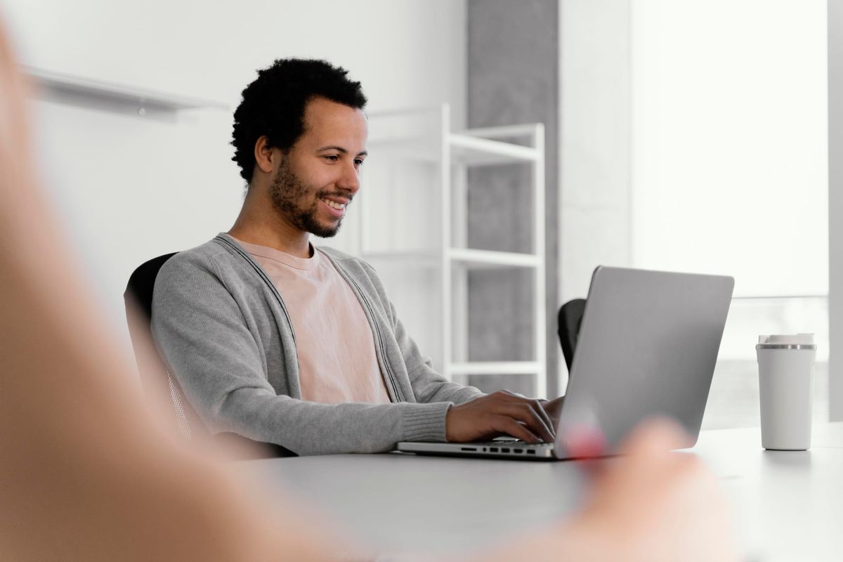 man on a laptop - Can You Download YouTube Videos to Watch Offline