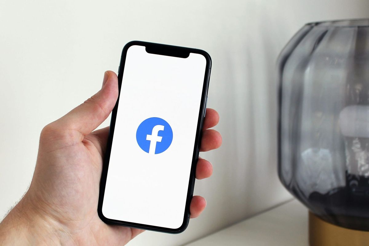 Person Using facebook - How Much Does Facebook Reels Pay Per 1,000 Views