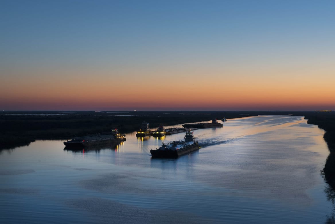 Barges traveling through a short canal