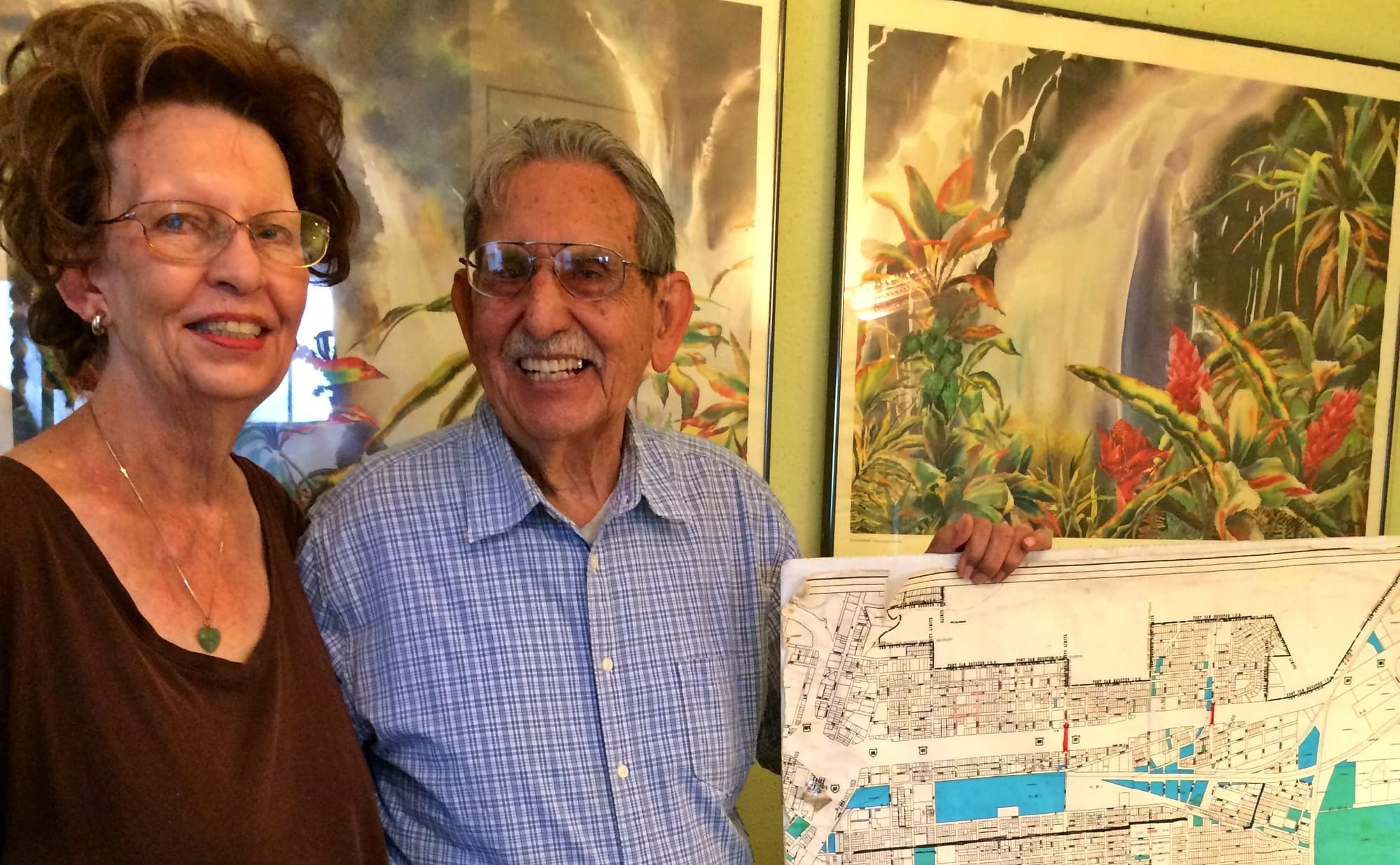 Jo Ann and Gil Murillo with a map of the neighborhood