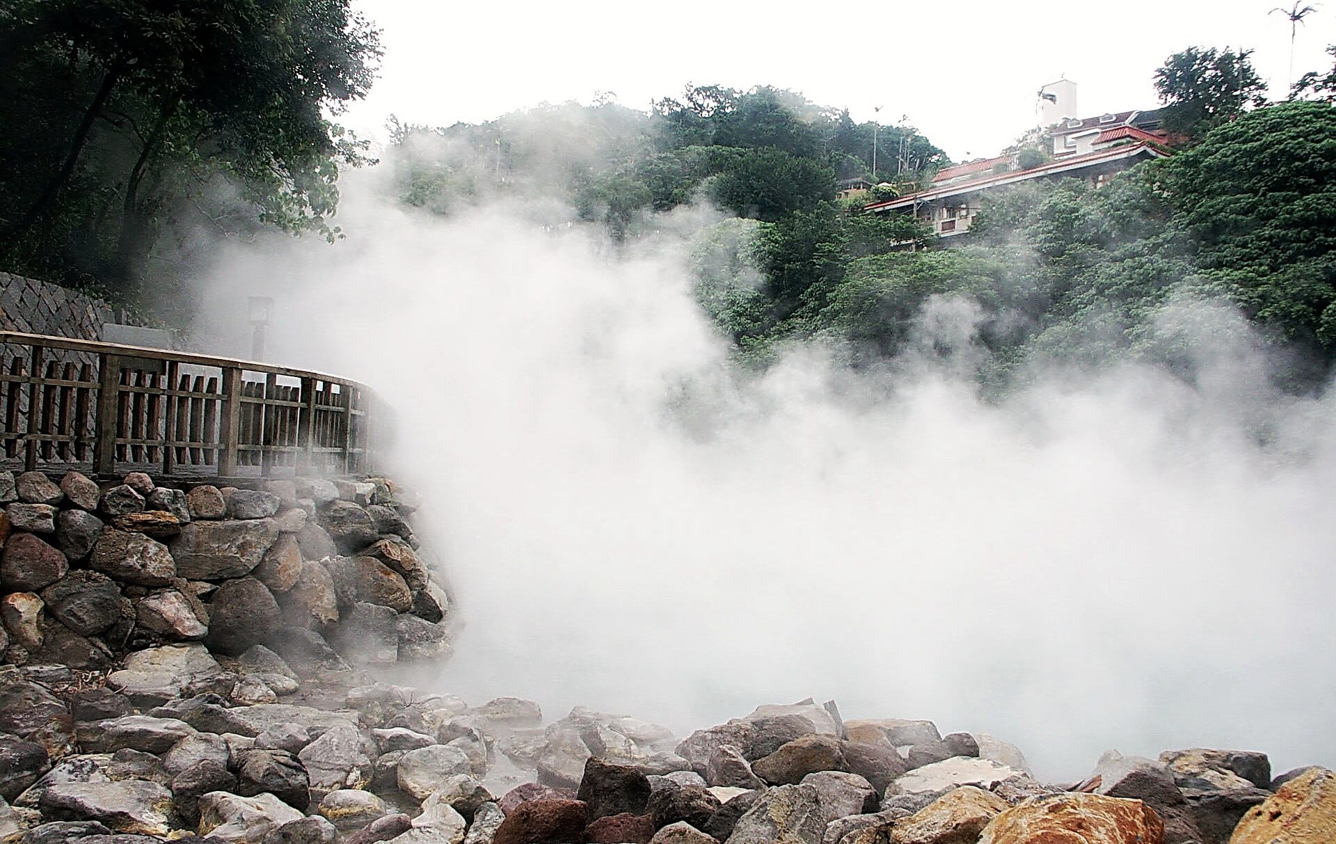 Steam rising off the milky green water of Beitou Thermal Valley