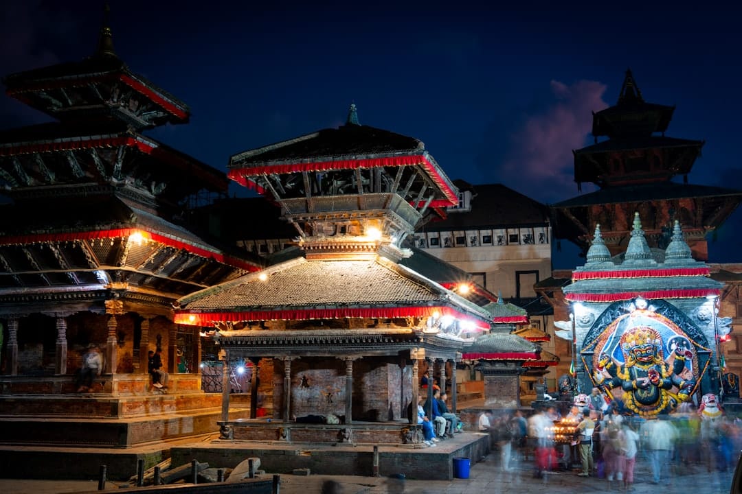 Kathmandu Durbar Square at dusk, with the Kal Bhairav shrine glowing on the right